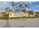 Gran Lago entrance sign surrounded by manicured landscaping and palm trees at 13145 Amerigo Ln, Venice, FL 34293