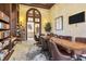 Inviting conference room with large table, leather chairs, and a wall of bookshelves at 13145 Amerigo Ln, Venice, FL 34293