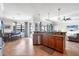 Inviting kitchen with granite countertops, a view of the lanai, and seamless access to the living area at 13145 Amerigo Ln, Venice, FL 34293
