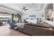 Inviting living room with lake view, tray ceilings, neutral paint, tile floors, and modern decor at 13145 Amerigo Ln, Venice, FL 34293