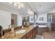 Luxurious main bathroom with dual vanity, soaking tub, walk-in shower, and granite countertops at 13145 Amerigo Ln, Venice, FL 34293