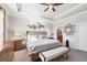 Spacious main bedroom features decorative trey ceiling, and view of the ensuite bathroom at 13145 Amerigo Ln, Venice, FL 34293