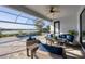 Inviting outdoor pool area with ample seating and a serene lake view for relaxing afternoons at 13145 Amerigo Ln, Venice, FL 34293