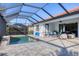 Stunning pool and patio area with comfortable seating for relaxation at 13145 Amerigo Ln, Venice, FL 34293