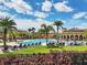Beautiful community pool surrounded by lush landscaping, lounge chairs, and well-maintained lawns at 13145 Amerigo Ln, Venice, FL 34293