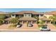 Aerial view showcasing the townhouse complex with well-maintained landscaping and parking at 13719 Messina Loop # 101, Lakewood Ranch, FL 34211
