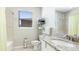 Cozy bathroom with granite countertop, tub shower and ample storage at 13719 Messina Loop # 101, Lakewood Ranch, FL 34211