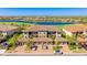 Beautiful condominium building with attached garages, lush landscaping and a gorgeous lake view at 13719 Messina Loop # 101, Lakewood Ranch, FL 34211