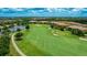 Scenic aerial view of the lush community golf course, showcasing manicured greens and picturesque landscaping at 13719 Messina Loop # 101, Lakewood Ranch, FL 34211