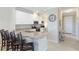 Modern kitchen with white cabinets, granite countertops, stainless steel appliances and a breakfast bar at 13719 Messina Loop # 101, Lakewood Ranch, FL 34211