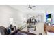 Comfortable and bright living area adjacent to kitchen and dining with view of outdoors at 13719 Messina Loop # 101, Lakewood Ranch, FL 34211