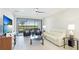 Well-lit living room featuring comfortable seating with view to outdoors and community at 13719 Messina Loop # 101, Lakewood Ranch, FL 34211