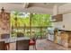 Outdoor kitchen equipped with grill, countertop, and dining area, perfect for entertaining at 13719 Messina Loop # 101, Lakewood Ranch, FL 34211