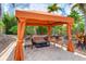 Inviting outdoor lounge area with comfortable seating under a shaded canopy, perfect for relaxation at 13719 Messina Loop # 101, Lakewood Ranch, FL 34211