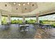 Comfortable outdoor seating area with picturesque views of the lake and golf course at 13719 Messina Loop # 101, Lakewood Ranch, FL 34211