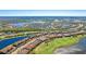Beautiful aerial view showcases the community, golf course, and multiple lakes surrounding the property at 13719 Messina Loop # 101, Lakewood Ranch, FL 34211