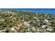 Aerial view showcasing this home's location among a mature treed neighborhood near the bay at 1406 5Th W St, Palmetto, FL 34221