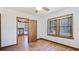Cozy bedroom adjacent to the living area, offering natural light and hardwood floors at 1406 5Th W St, Palmetto, FL 34221