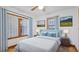 Tranquil bedroom with calming blue accents, beautiful wall art, and natural lighting at 1406 5Th W St, Palmetto, FL 34221