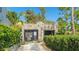 Unique stone building with a well-manicured lawn and mature trees at 1406 5Th W St, Palmetto, FL 34221