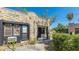 Detailed view of a stone home with black trim and minimal landscaping at 1406 5Th W St, Palmetto, FL 34221