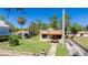 Charming stone home with a well-manicured lawn, unique architectural details, and a quaint walkway at 1406 5Th W St, Palmetto, FL 34221