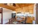 Open kitchenette with light wood cabinets and stainless steel appliances at 1406 5Th W St, Palmetto, FL 34221