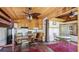 Cozy living area with wood ceilings, ceiling fans, and a partial kitchen at 1406 5Th W St, Palmetto, FL 34221