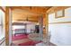 Bright living area featuring a round glass table, bunkbeds, and white walls at 1406 5Th W St, Palmetto, FL 34221
