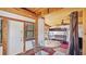 Charming living area with a glass table, bunkbeds, and wood-paneled ceiling at 1406 5Th W St, Palmetto, FL 34221
