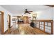 Bright living room featuring hardwood floors, a cozy stone fireplace, and an open layout at 1406 5Th W St, Palmetto, FL 34221