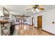 Spacious living room boasting hardwood floors, stone fireplace, and seamless access to other living areas at 1406 5Th W St, Palmetto, FL 34221