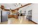 Spacious living space with a wood-burning fireplace that seamlessly connects the kitchen and living areas at 1406 5Th W St, Palmetto, FL 34221