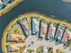 Aerial view displaying backyard pools of homes surrounding a cul-de-sac in a lakeside community at 15430 Blackmoor Ter, Lakewood Ranch, FL 34202