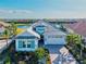 Stunning aerial view of a home showcasing the roof, front yard, and a paver driveway at 15430 Blackmoor Ter, Lakewood Ranch, FL 34202
