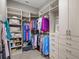Organized walk-in closet featuring ample shelving, clothing racks, and a built-in dresser at 15430 Blackmoor Ter, Lakewood Ranch, FL 34202