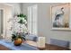 Dining room decor featuring a wooden table with blue runner, floral centerpiece, and shutters on the window at 15430 Blackmoor Ter, Lakewood Ranch, FL 34202