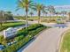 Entrance to The Lodge at Lakewood National Golf and Country Club featuring lush tropical landscaping at 15430 Blackmoor Ter, Lakewood Ranch, FL 34202