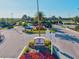 Community entrance featuring tropical landscaping and well maintained grounds at The Retreat at 15430 Blackmoor Ter, Lakewood Ranch, FL 34202