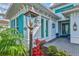 Close-up of the home's entrance shows brick pathway and decorative lighting at 15430 Blackmoor Ter, Lakewood Ranch, FL 34202