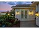 Professionally landscaped front yard with accent lighting at 15430 Blackmoor Ter, Lakewood Ranch, FL 34202