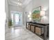Bright foyer features marble floors, console table, and decorative accents at 15430 Blackmoor Ter, Lakewood Ranch, FL 34202