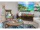 Living room featuring stylish decor, comfortable seating, and a large screen TV for relaxing entertainment at 15430 Blackmoor Ter, Lakewood Ranch, FL 34202