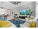 Open concept living room with stylish furniture, large windows, and views to the kitchen at 15430 Blackmoor Ter, Lakewood Ranch, FL 34202