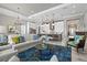 Open concept living room, dining room, and kitchen with stylish decor at 15430 Blackmoor Ter, Lakewood Ranch, FL 34202
