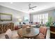 Open living area featuring comfortable seating, a stylish area rug, and ample natural light at 15430 Blackmoor Ter, Lakewood Ranch, FL 34202