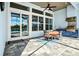 Outdoor kitchen and dining area on a patio, perfect for entertaining with views of the pool at 15430 Blackmoor Ter, Lakewood Ranch, FL 34202