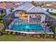 Inviting screened-in pool and patio area with lush landscaping, perfect for outdoor entertaining at 15430 Blackmoor Ter, Lakewood Ranch, FL 34202