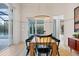 Dining area with contemporary lighting and access to an outdoor patio at 16419 Kendleshire Ter, Lakewood Ranch, FL 34202