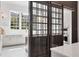 Bright kitchen with modern appliances, white countertops, and stylish sliding barn doors at 16419 Kendleshire Ter, Lakewood Ranch, FL 34202